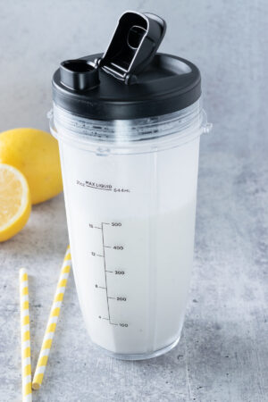 A Ninja personal cup blender that has a homemade Chick-fil-A Frosted Lemonade blended in it.