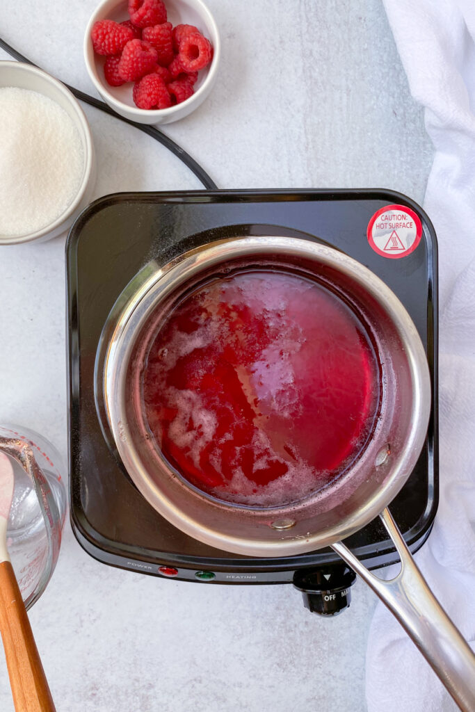 Raspberry syrup in a saucepan on the stove for just a minute to completely dissolve all the sugar.
