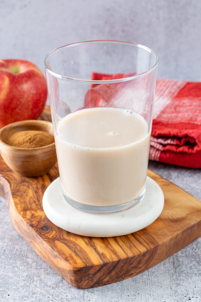 Milk poured into the chai concentrate to make a chai tea latte.