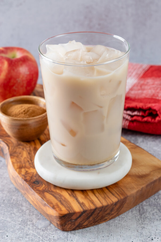 Chai tea latte in a glass filled with ice.