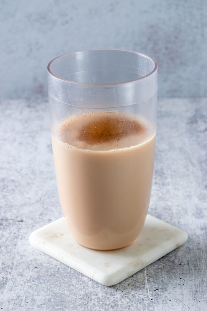 Ground cinnamon sprinkled into shaker.