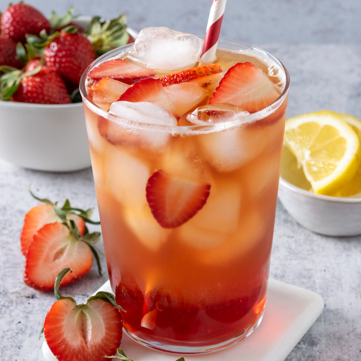 Navigation image for iced tea drink recipes, showing a glass of strawberry iced tea.